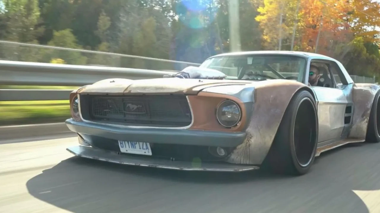 blue bowl of black bean beef tortilla soup on a board with cilantro and shredded cheese in background